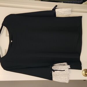 Elegant top, elbow length sleeves with a contrast trim lace, adorned silk bows